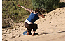 Sandboarding Down The Natural Dune