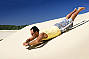 Sand tobogganing on the Desert Safari Tour